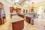 First Floor Gourmet Kitchen with Breakfast Bar and Stainless Steel Appliances